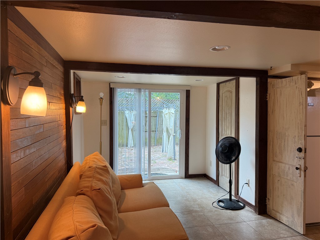 601 East 30th Street, Unit B Bryan, TX 77803 - Photo 5 of 15 a living room with furniture and a large window