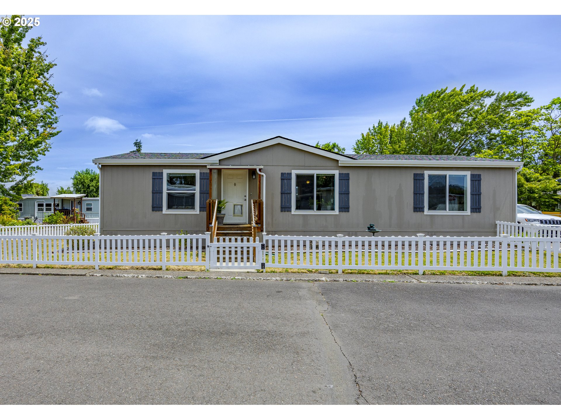 a front view of a house with a fence