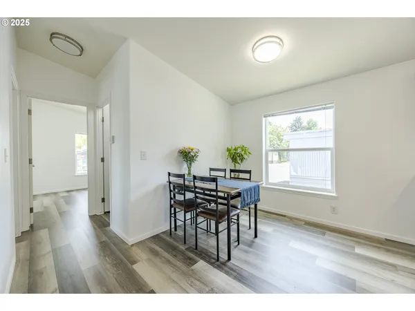 a dining room with furniture and window