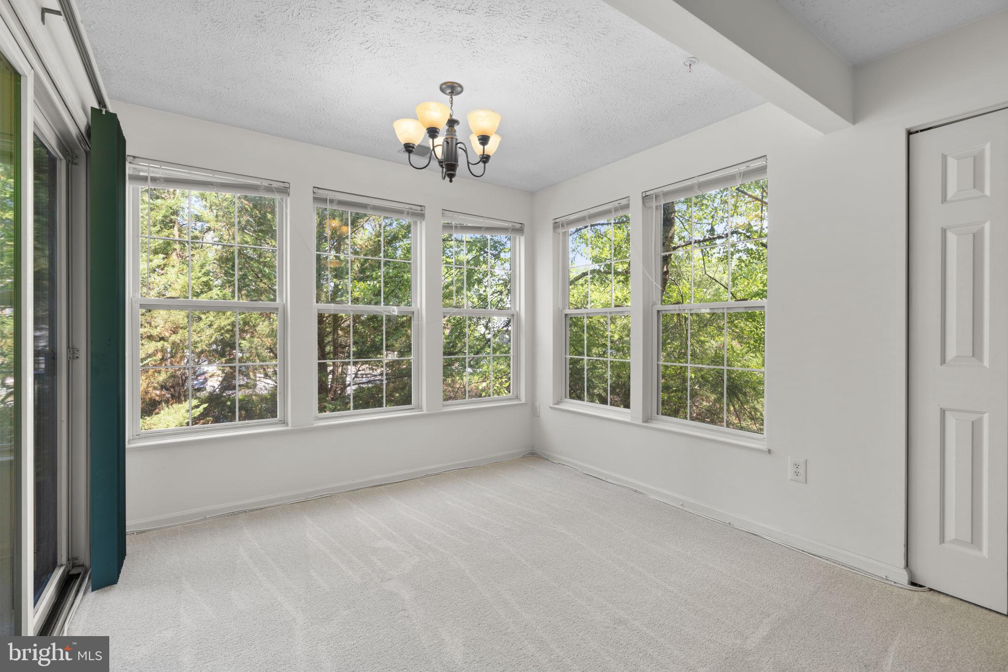 2444 Blue Spring Court, Unit 203 Odenton, MD 21113 - Photo 9 of 36 a view of an empty room with a window