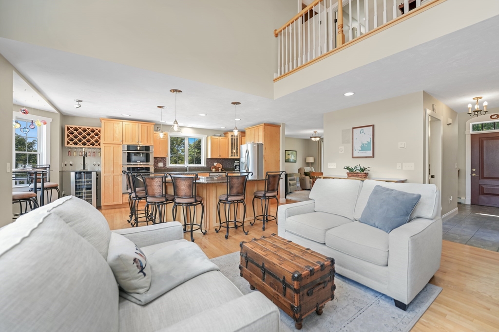 57 Perry Hill Road Acushnet, MA 02743 - Photo 11 of 40 a living room with furniture and a view of kitchen
