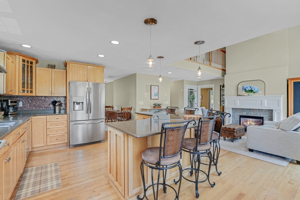 57 Perry Hill Road Acushnet, MA 02743 - Photo 15 of 40 a large kitchen with a table and chairs