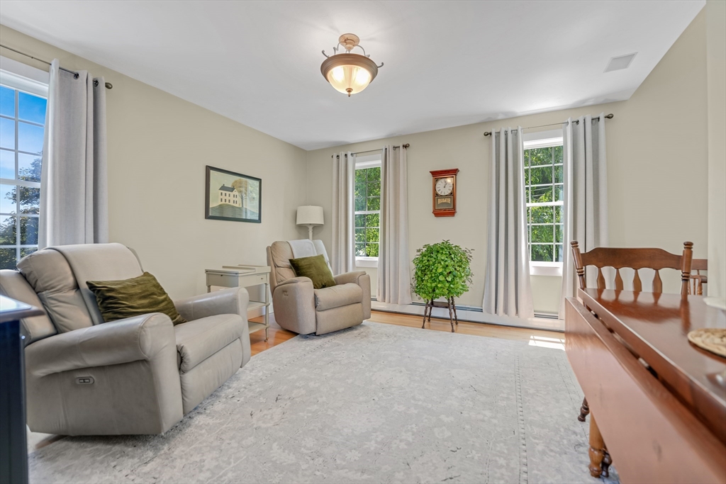 57 Perry Hill Road Acushnet, MA 02743 - Photo 19 of 40 a living room with furniture and a potted plant