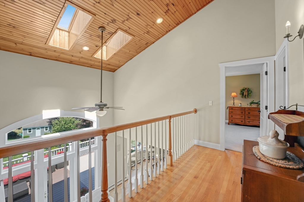 57 Perry Hill Road Acushnet, MA 02743 - Photo 26 of 40 a view of a hallway with furniture and wooden floor