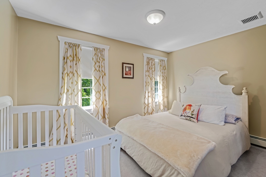 57 Perry Hill Road Acushnet, MA 02743 - Photo 29 of 40 a bedroom with a bed and a window