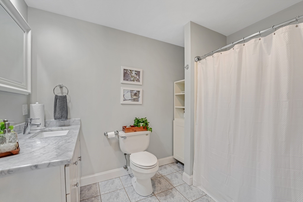 57 Perry Hill Road Acushnet, MA 02743 - Photo 30 of 40 a white toilet sitting next to a bathroom sink