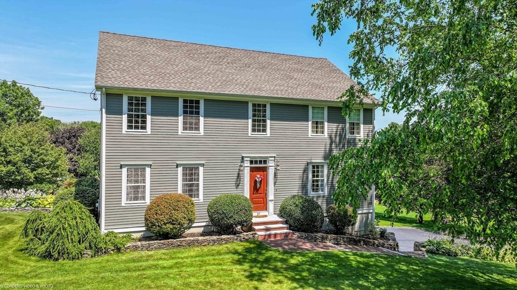 57 Perry Hill Road Acushnet, MA 02743 - Photo 3 of 40 a front view of a house with a yard and potted plants