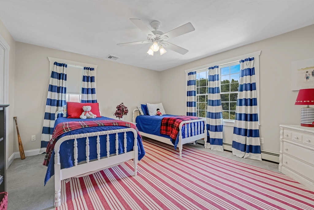 57 Perry Hill Road Acushnet, MA 02743 - Photo 33 of 40 a bedroom with furniture and a book shelf