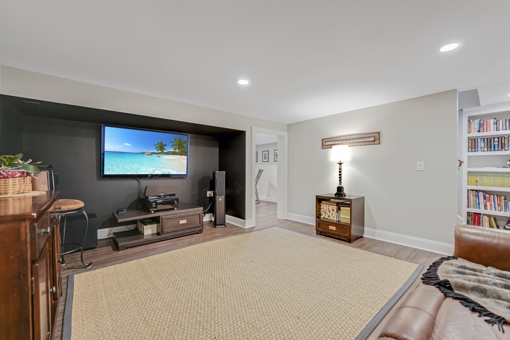 57 Perry Hill Road Acushnet, MA 02743 - Photo 34 of 40 a bedroom with furniture and a flat screen tv