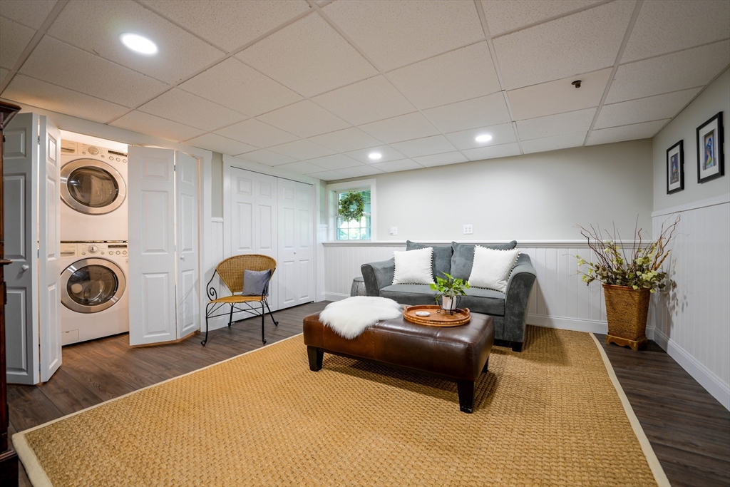 57 Perry Hill Road Acushnet, MA 02743 - Photo 37 of 40 a living room with furniture and a fireplace