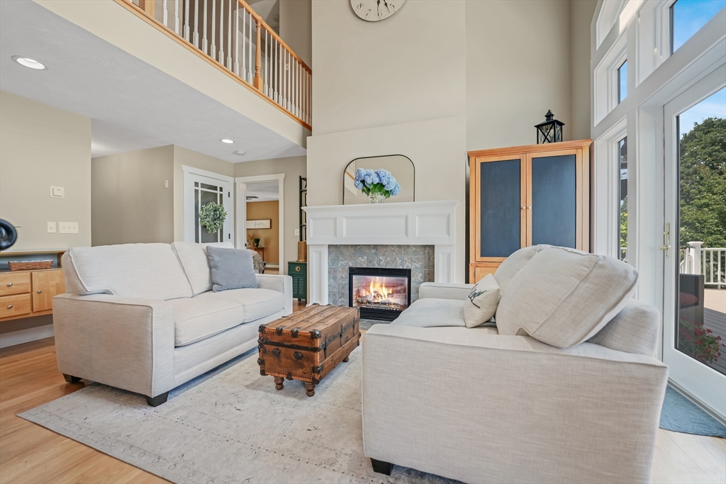 57 Perry Hill Road Acushnet, MA 02743 - Photo 8 of 40 a living room with furniture and a fireplace