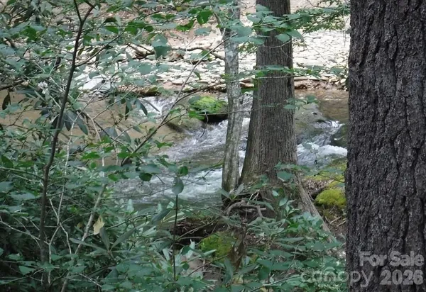 a view of a water pond with green space