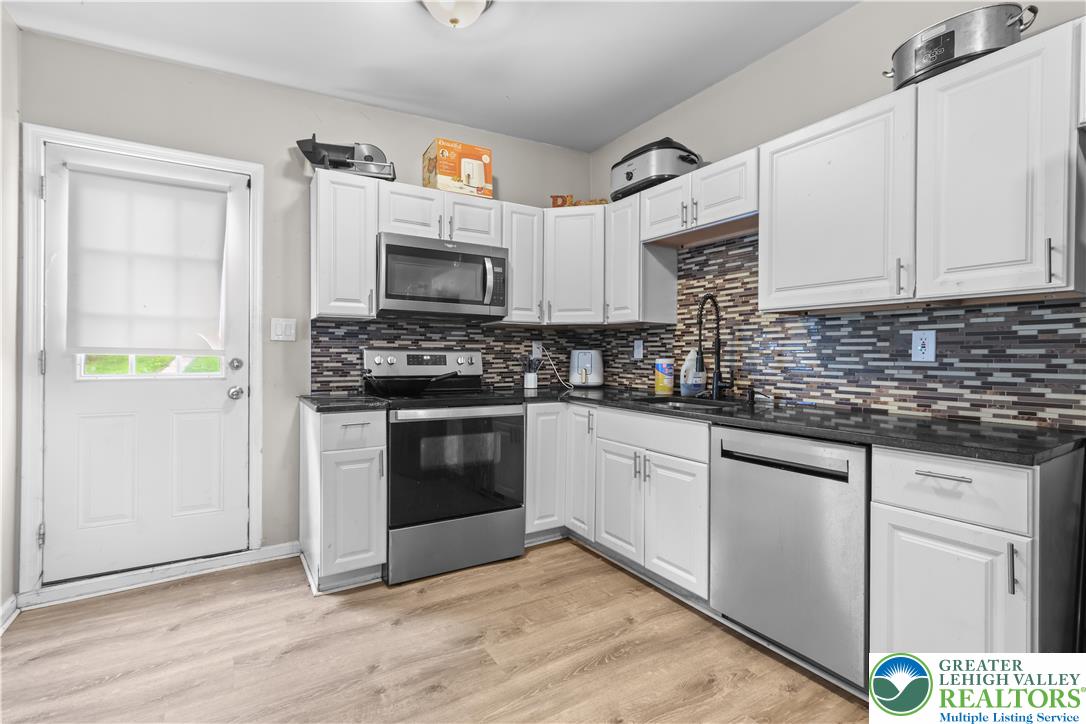 12 South Front Street Coplay, PA 18037 - Photo 23 of 41 This thoughtfully designed kitchen offers both functionality and style for modern living.