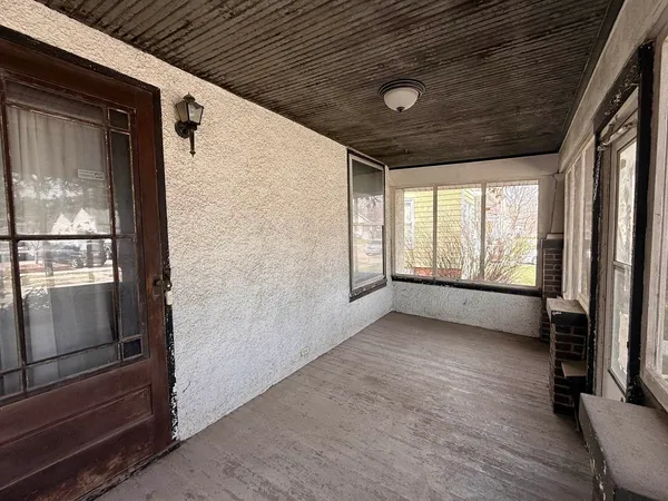 a large bedroom with a bed and a window