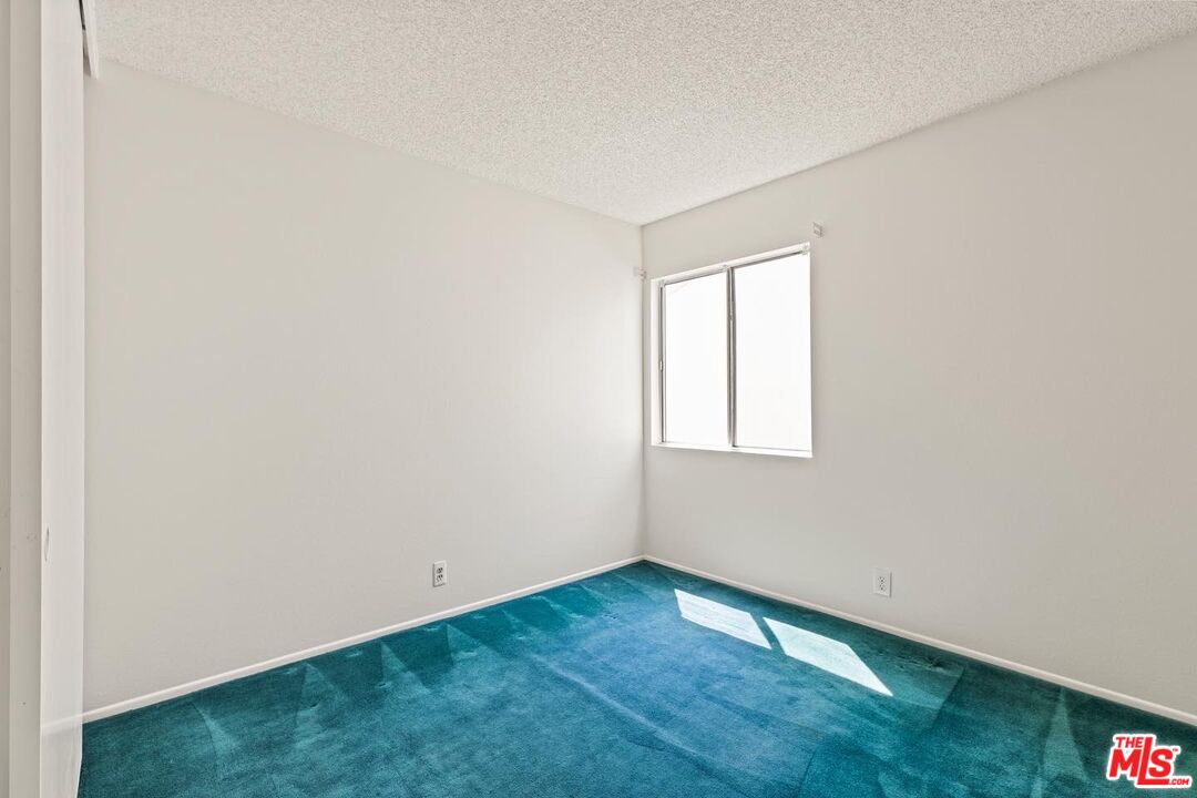 106 Sequoia Tree Lane Irvine, CA 92612 - Photo 13 of 36 a view of an empty room with wooden floor and a window