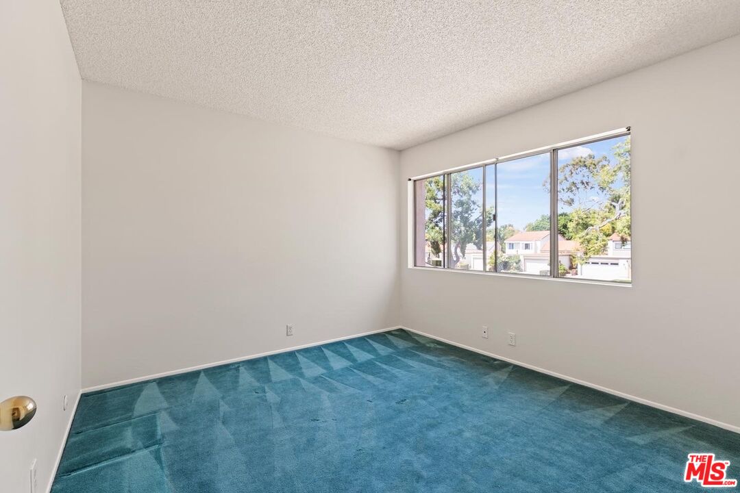 106 Sequoia Tree Lane Irvine, CA 92612 - Photo 17 of 36 an empty room with windows