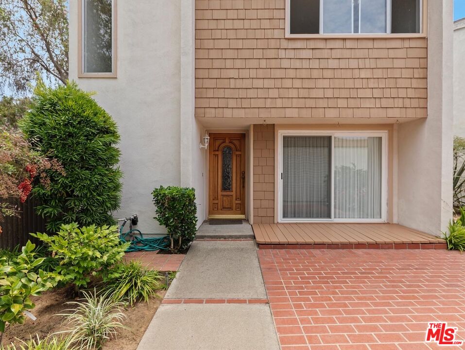 106 Sequoia Tree Lane Irvine, CA 92612 - Photo 2 of 36 front view of a brick house with a large window