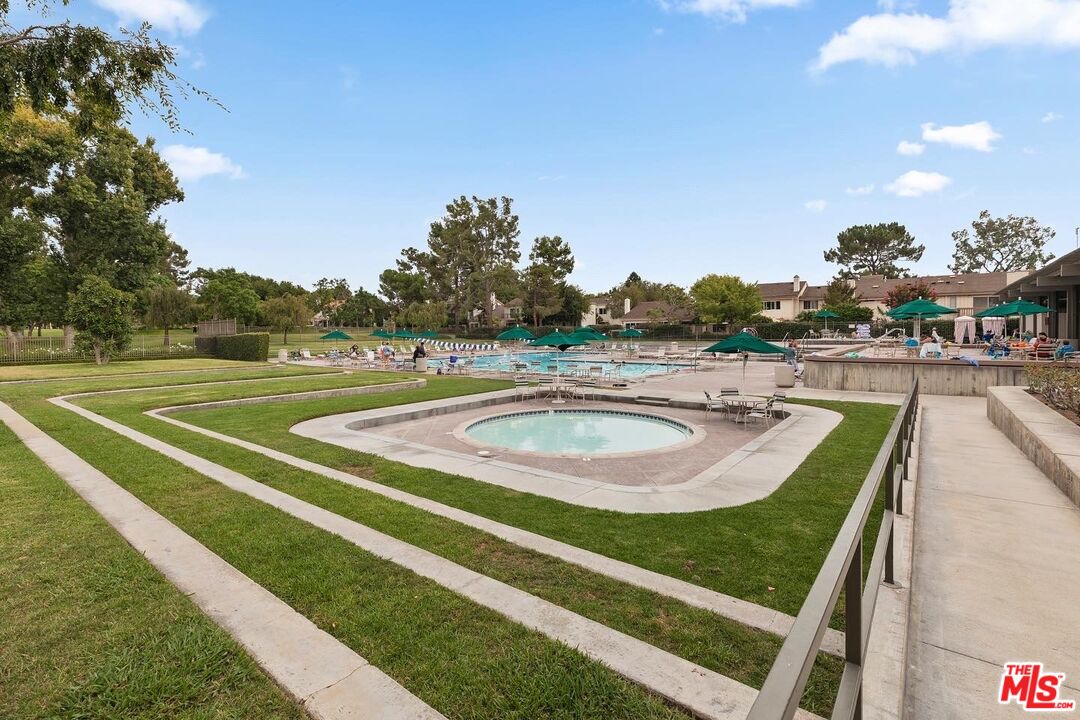 106 Sequoia Tree Lane Irvine, CA 92612 - Photo 27 of 36 a view of a swimming pool with outdoor seating and plants