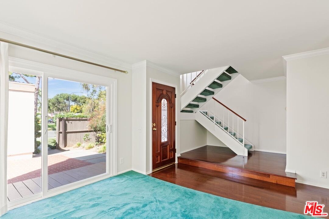 106 Sequoia Tree Lane Irvine, CA 92612 - Photo 3 of 36 a view of entryway and hall with wooden floor