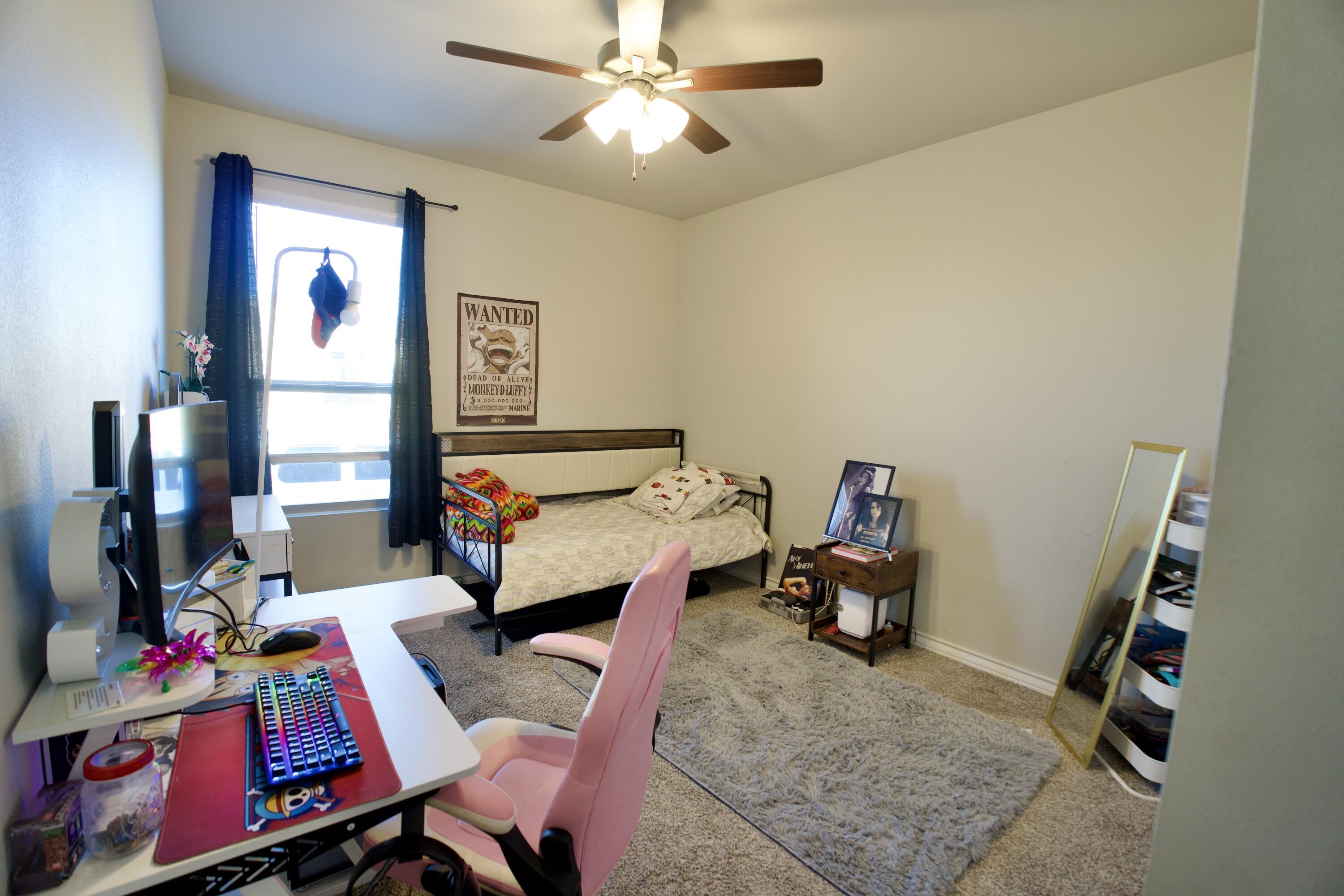 5801 Winfield Avenue Lubbock, TX 79407 - Photo 15 of 20 a living room with furniture and a flat screen tv