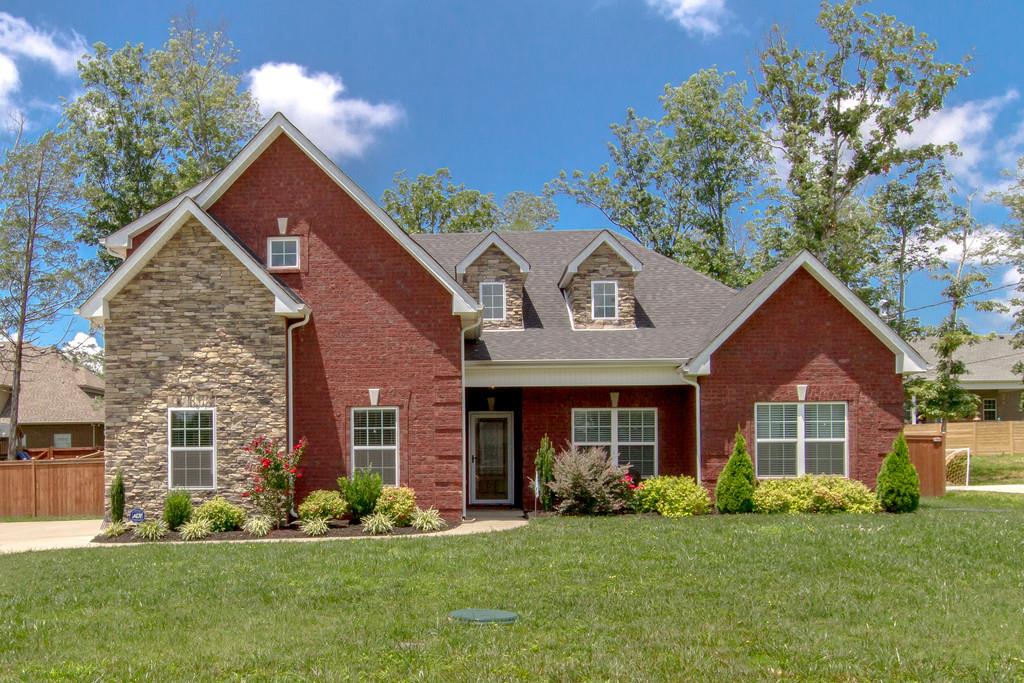  All brick & stone beautiful 3 bedroom/2 bath/2 car side entry garage w/pedestrian door, privacy fence on large lot in desirable community!!!