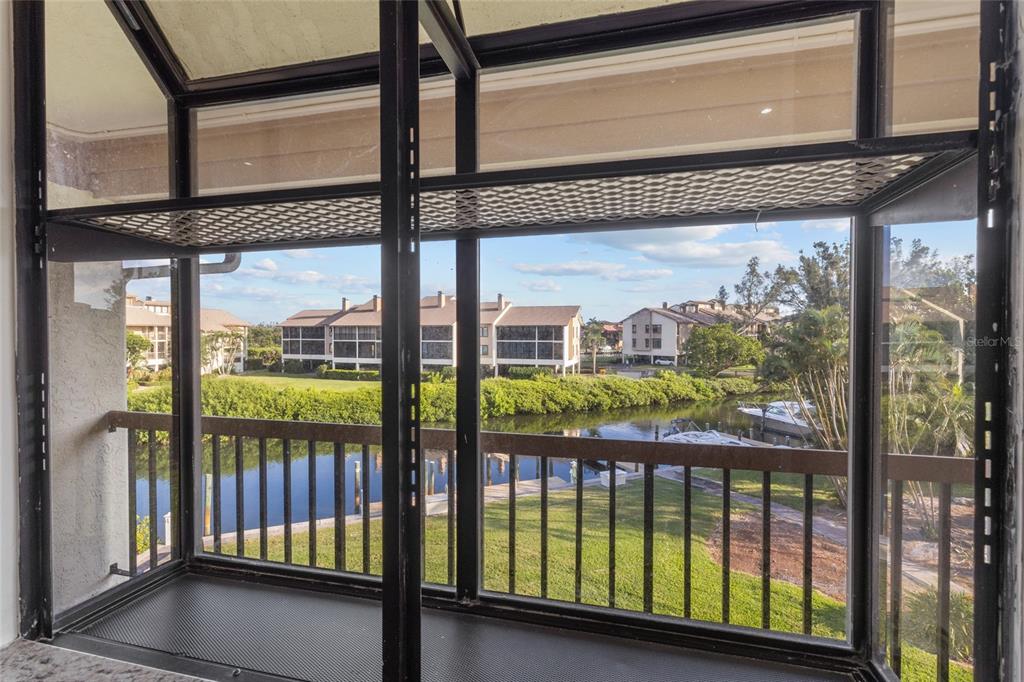 3840 Mariners Way, Unit 525 Cortez, FL 34215 - Photo 11 of 48 a view of a street from a balcony