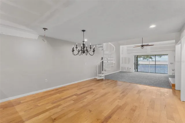 a view of a kitchen with wooden floor and a kitchen