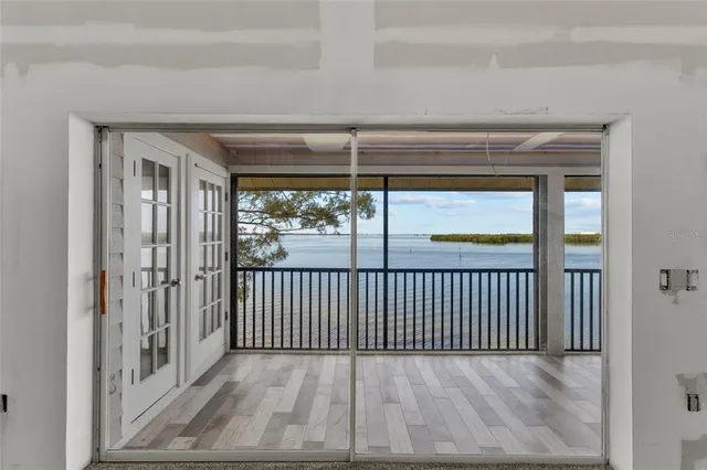a view of a livingroom with furniture and staircase