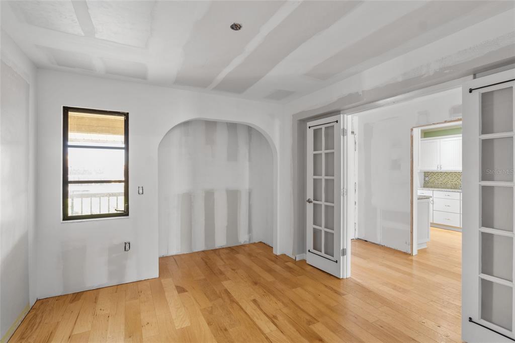 3840 Mariners Way, Unit 525 Cortez, FL 34215 - Photo 21 of 48 a view of empty room with wooden floor and fan