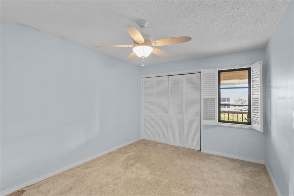 3840 Mariners Way, Unit 525 Cortez, FL 34215 - Photo 23 of 48 an empty room with windows and fan