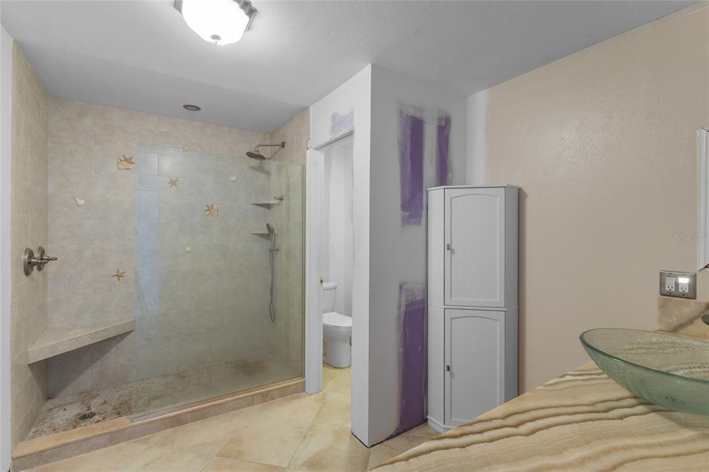 3840 Mariners Way, Unit 525 Cortez, FL 34215 - Photo 29 of 48 a bathroom with a shower and toilet