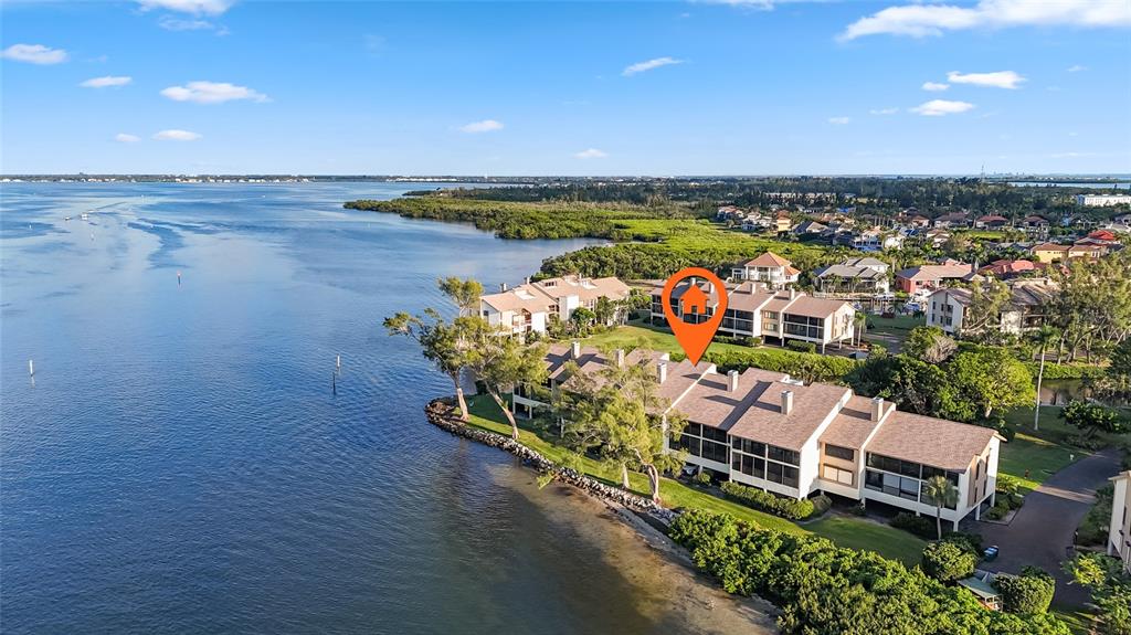 3840 Mariners Way, Unit 525 Cortez, FL 34215 - Photo 37 of 48 an aerial view of a house with outdoor space pool seating area and yard