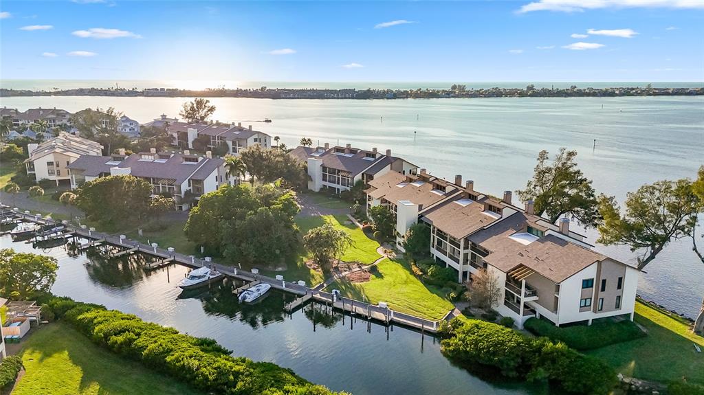 3840 Mariners Way, Unit 525 Cortez, FL 34215 - Photo 40 of 48 an aerial view of residential houses with outdoor space and lake view