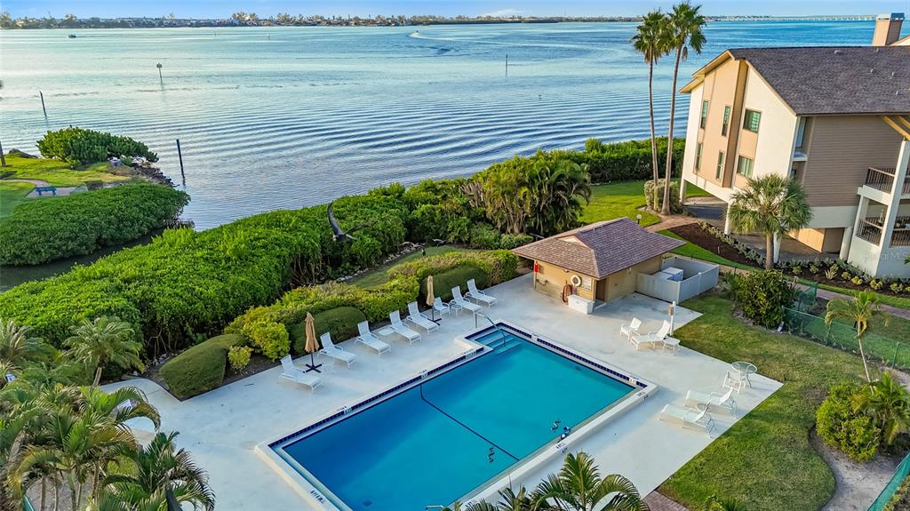 3840 Mariners Way, Unit 525 Cortez, FL 34215 - Photo 42 of 48 a view of a house with a yard