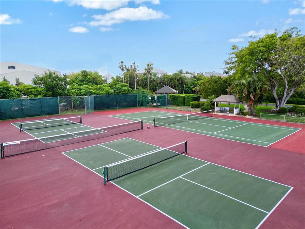3840 Mariners Way, Unit 525 Cortez, FL 34215 - Photo 44 of 48 a tennis court that has tennis net
