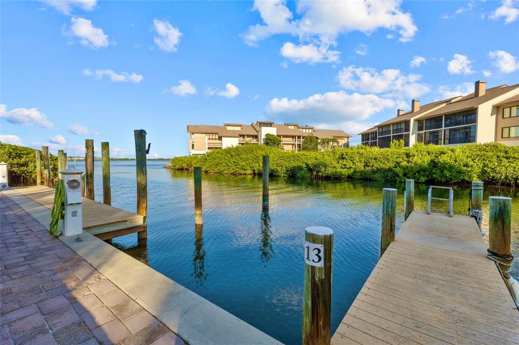 3840 Mariners Way, Unit 525 Cortez, FL 34215 - Photo 6 of 48 a view of a lake with a outdoor space