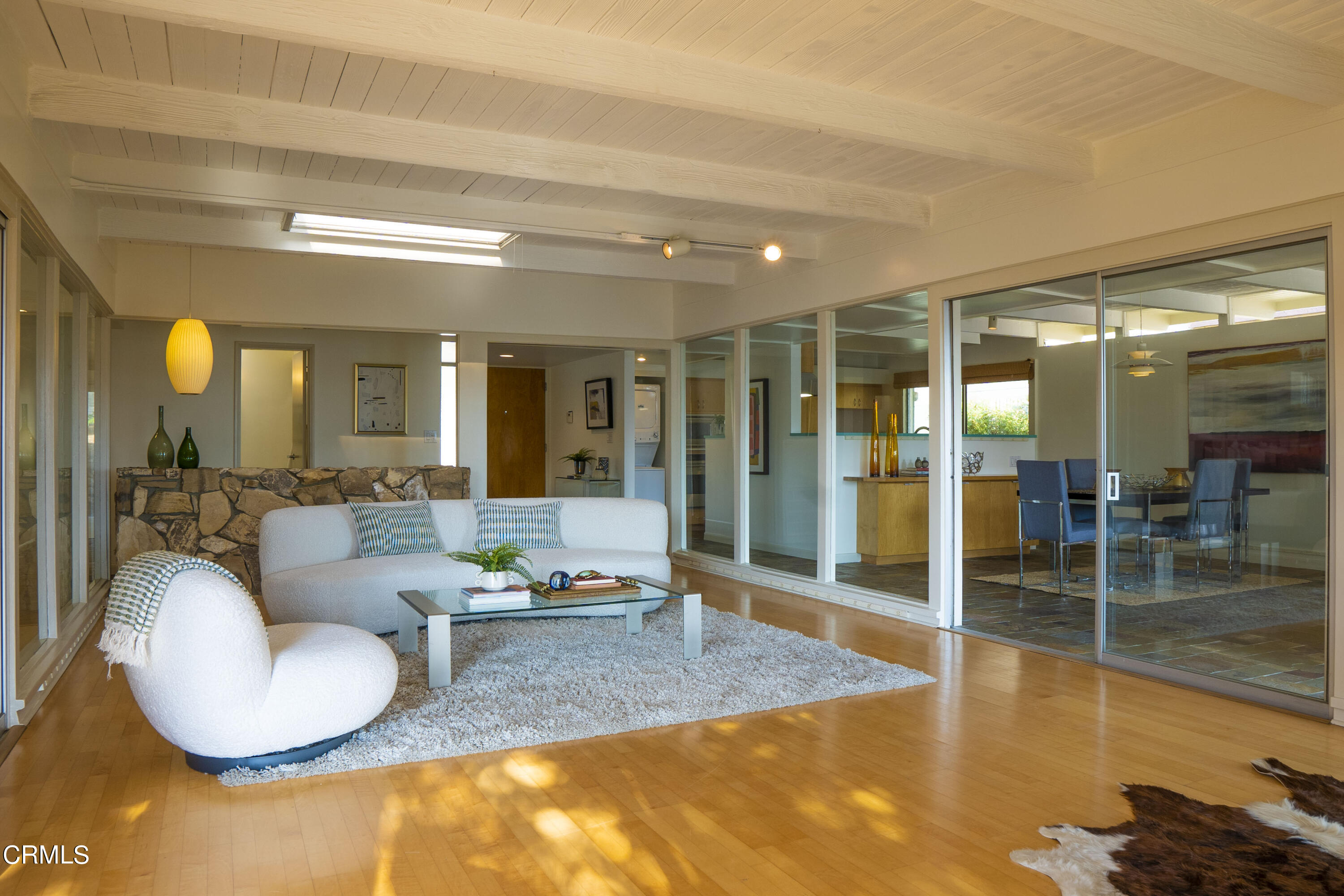 4017 Canyon Dell Drive Altadena, CA 91001 - Photo 2 of 28 a living room with fireplace furniture and a large window