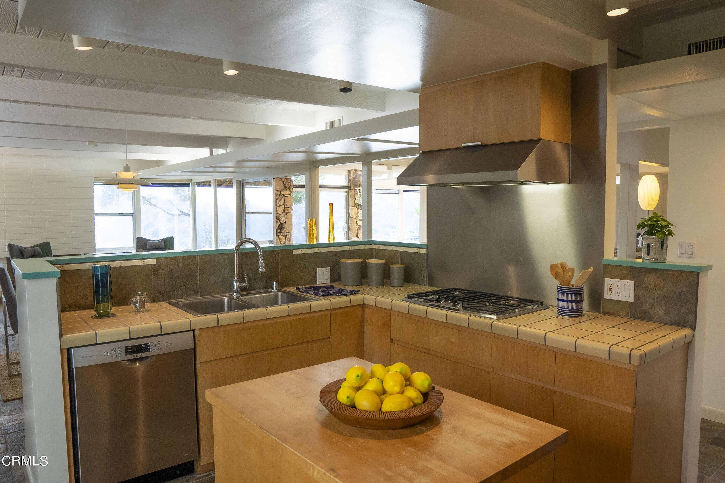 4017 Canyon Dell Drive Altadena, CA 91001 - Photo 11 of 28 a kitchen with stainless steel appliances granite countertop a sink a stove and a refrigerator