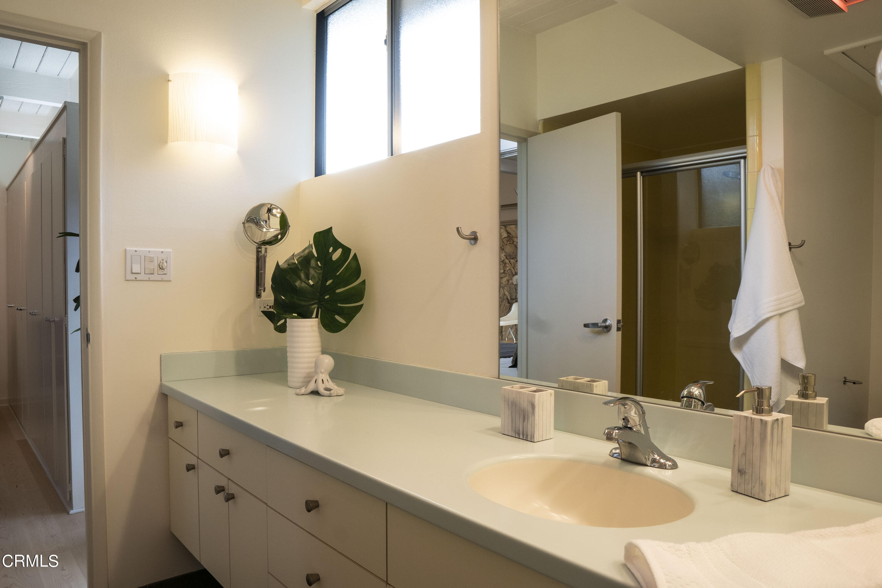 4017 Canyon Dell Drive Altadena, CA 91001 - Photo 12 of 28 a bathroom with a sink and a mirror