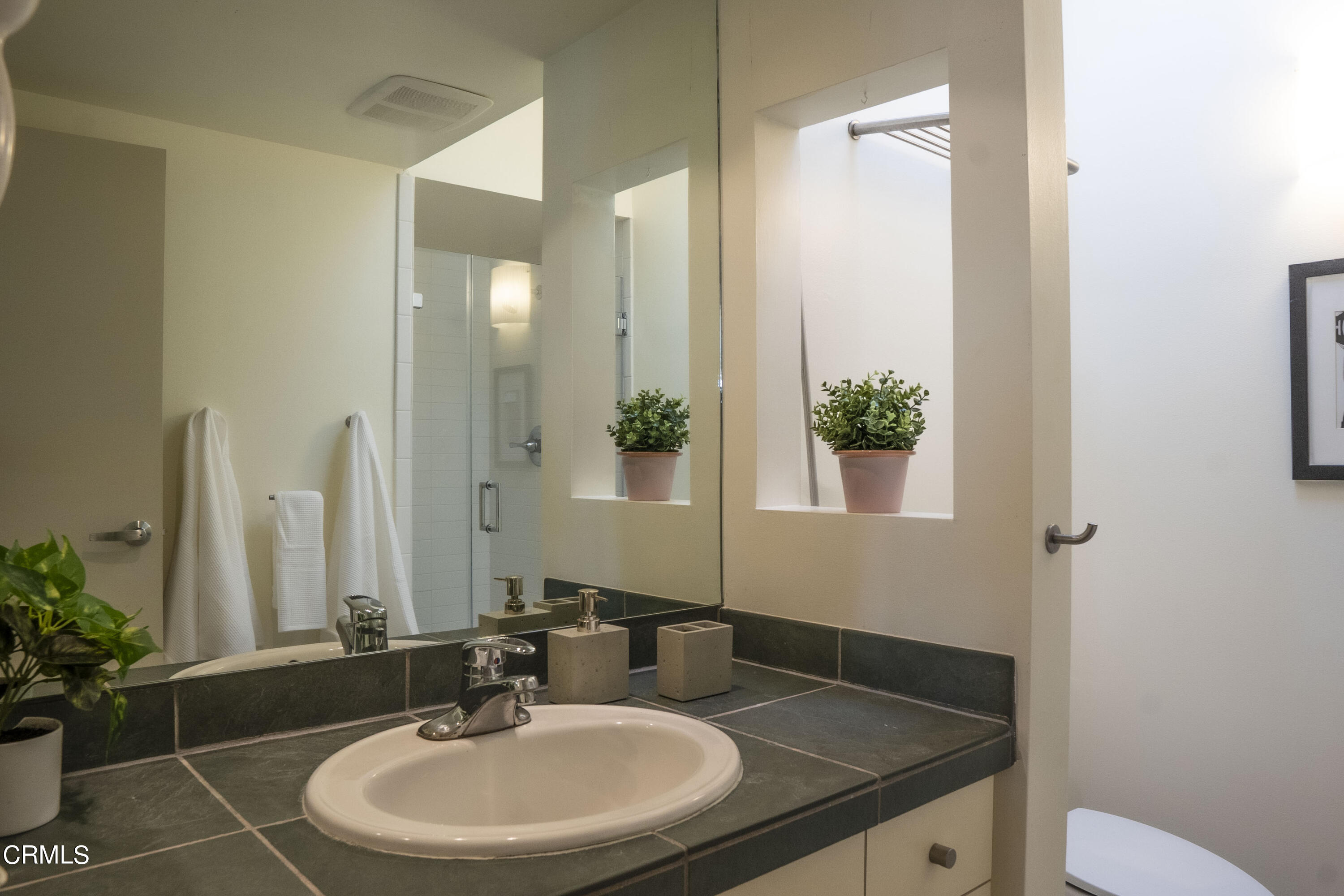 4017 Canyon Dell Drive Altadena, CA 91001 - Photo 15 of 28 a bathroom with a sink and a mirror