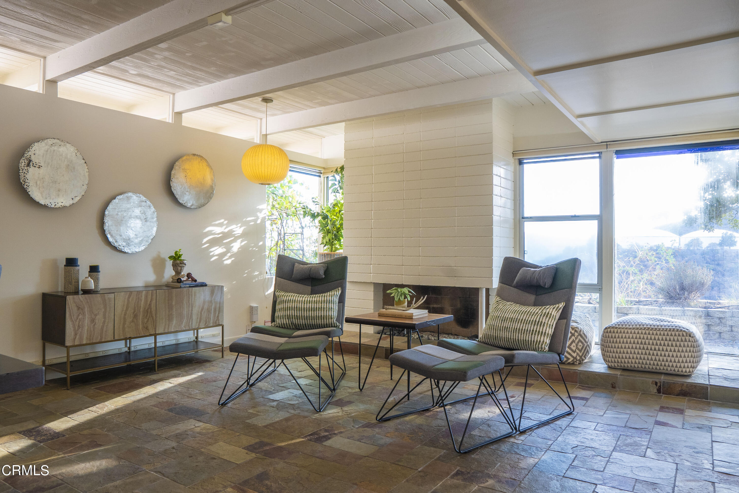 4017 Canyon Dell Drive Altadena, CA 91001 - Photo 9 of 28 a living room with furniture a fireplace and a large window