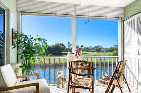a view of a chairs and table in patio