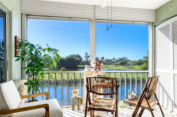 a view of a chairs and table in patio