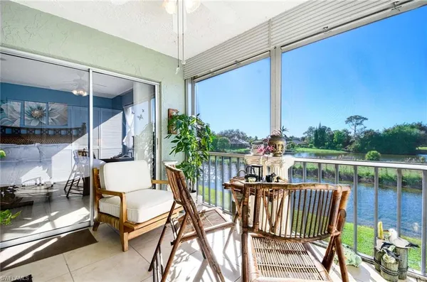 a view of balcony with furniture