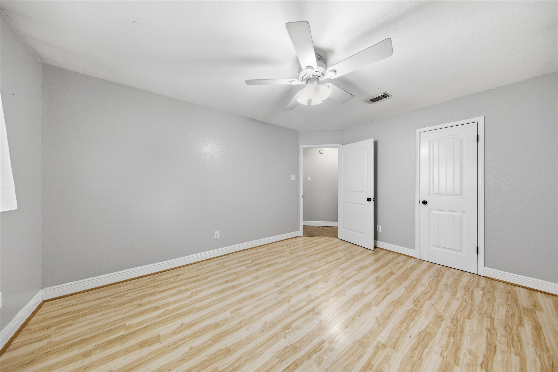 13506 Spring Court Tomball, TX 77375 - Photo 27 of 37 a view of an empty room with wooden floor