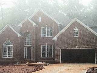 5232 Indigo Moon Way Raleigh, NC 27613 - Photo 1 of 1 a front view of a house with a yard