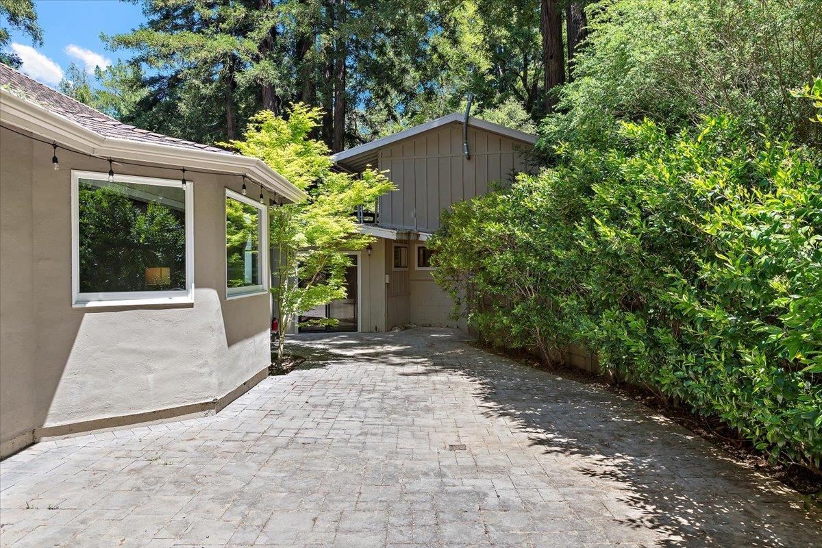885 Patrol Road Woodside, CA 94062 - Photo 34 of 34 a view of a house with a yard and potted plants