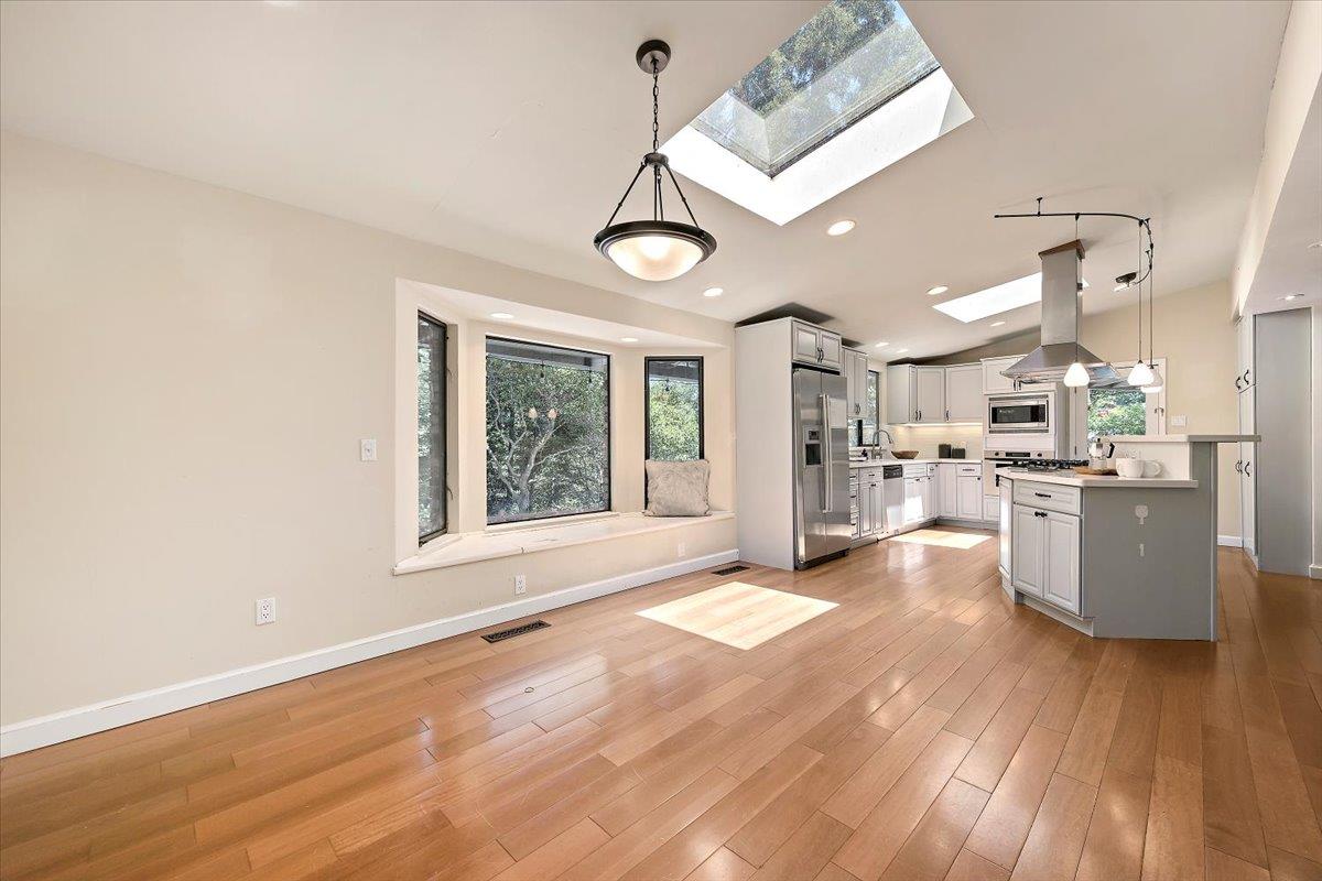 885 Patrol Road Woodside, CA 94062 - Photo 8 of 34 a view of a kitchen with furniture and wooden floor