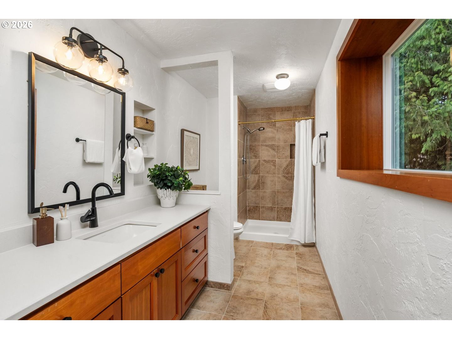 1641 Northwest 31st Avenue Camas, WA 98607 - Photo 21 of 39 a bathroom with a sink a mirror and a shower