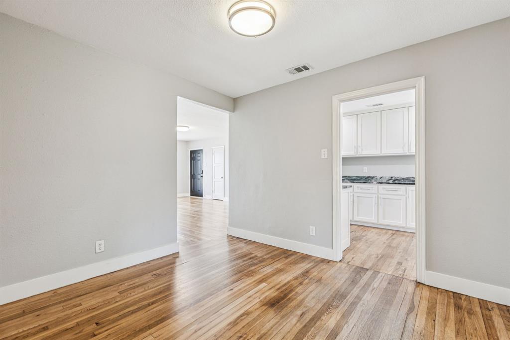 3226 Inwood Road Dallas, TX 75235 - Photo 20 of 25 a view of a kitchen cabinets and wooden floor